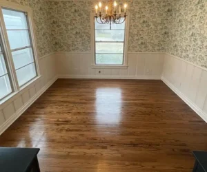 cardenas hardwood flooring in a room with pretty wallpaper