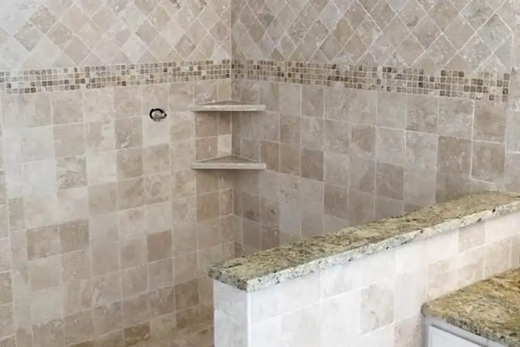 shower with tile work on the walls